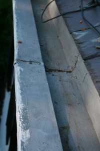 Cracks in the gutter seams, such as the one seen here, could go undetected if proper maintenance of a built-in gutter is neglected