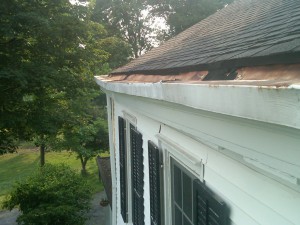 A sagging built-in gutter that pulled away from the house, allowing water to run down the side of the house and cause damage